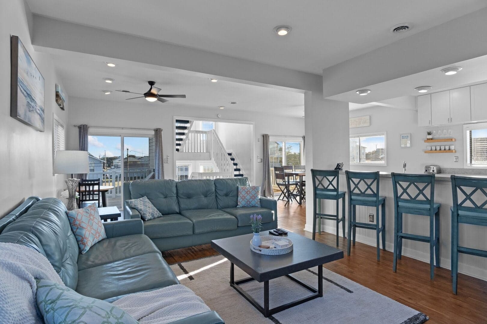 Open living room with sectional sofa and breakfast bar