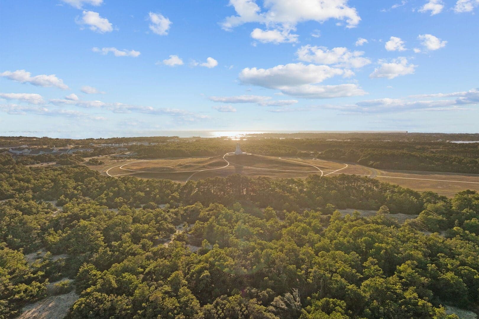 Aerial view of the Wright Brothers National Memorial at sunset